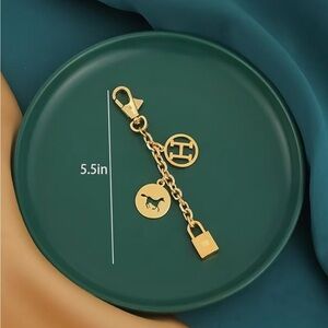 Gold purse chain/bag charm with iconic horse, lock, H charms